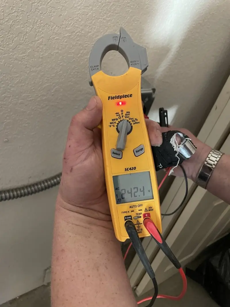 Voltage testing with clamp meter during Recessed Lighting Installation in Beaumont